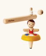 PlanToys wooden ballet spinning top. Includes a handle with string to thread and a ballerina spinning top