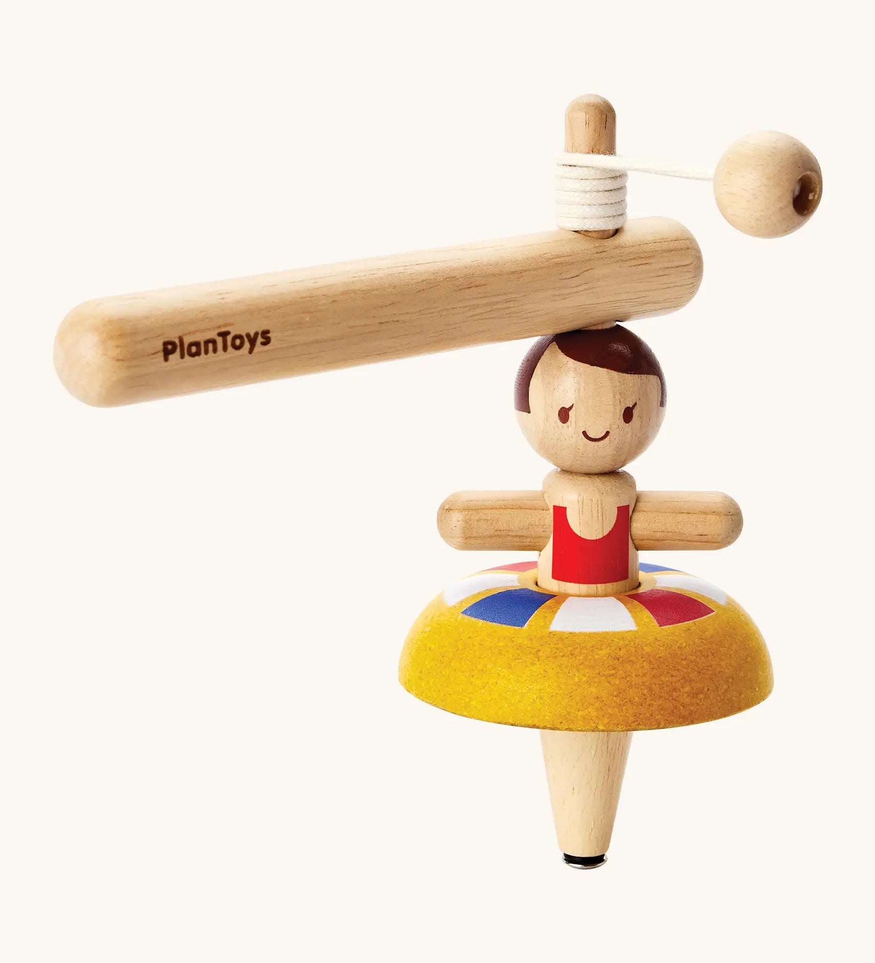 PlanToys wooden ballet spinning top. Includes a handle with string to thread and a ballerina spinning top