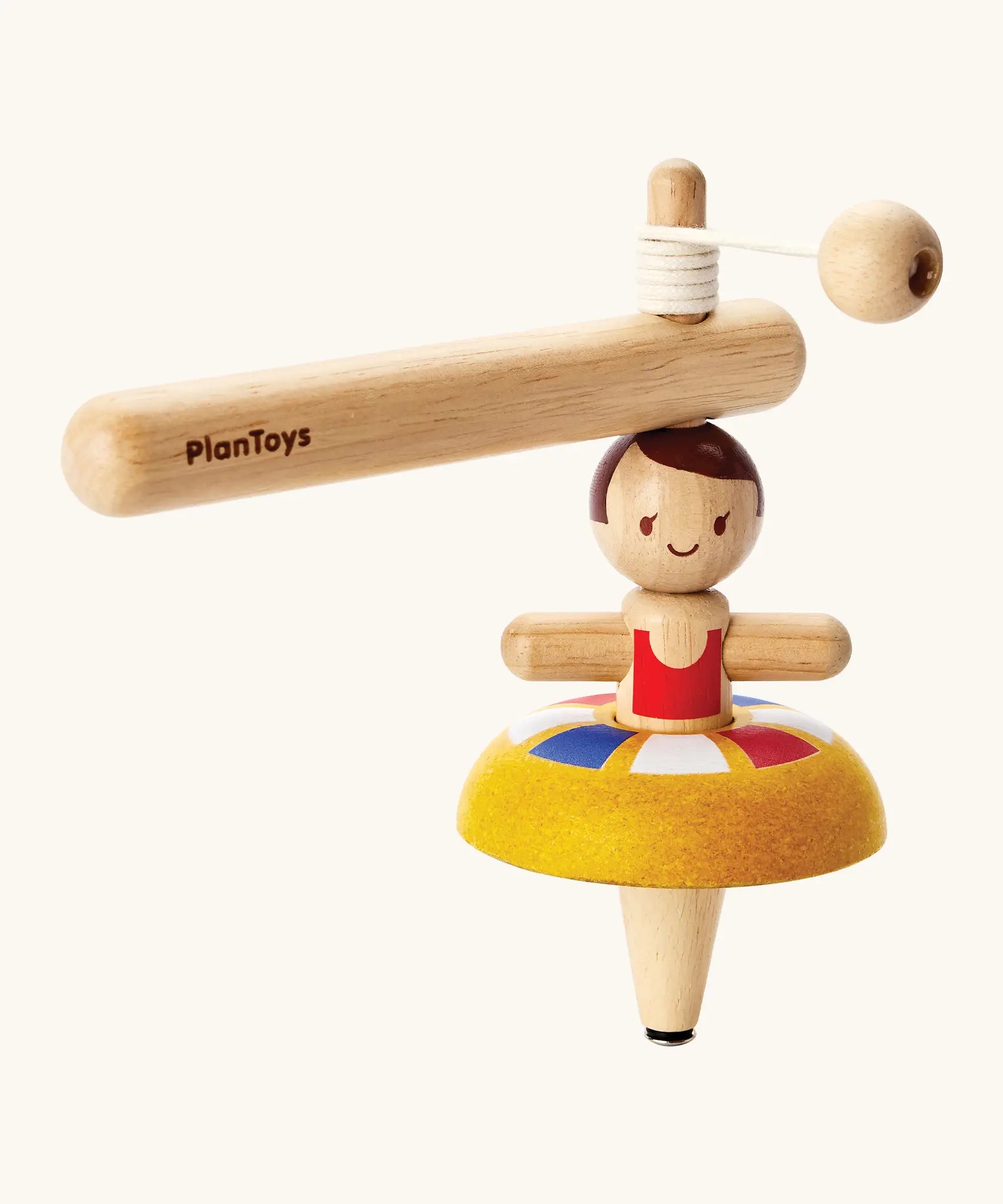 PlanToys wooden ballet spinning top. Includes a handle with string to thread and a ballerina spinning top