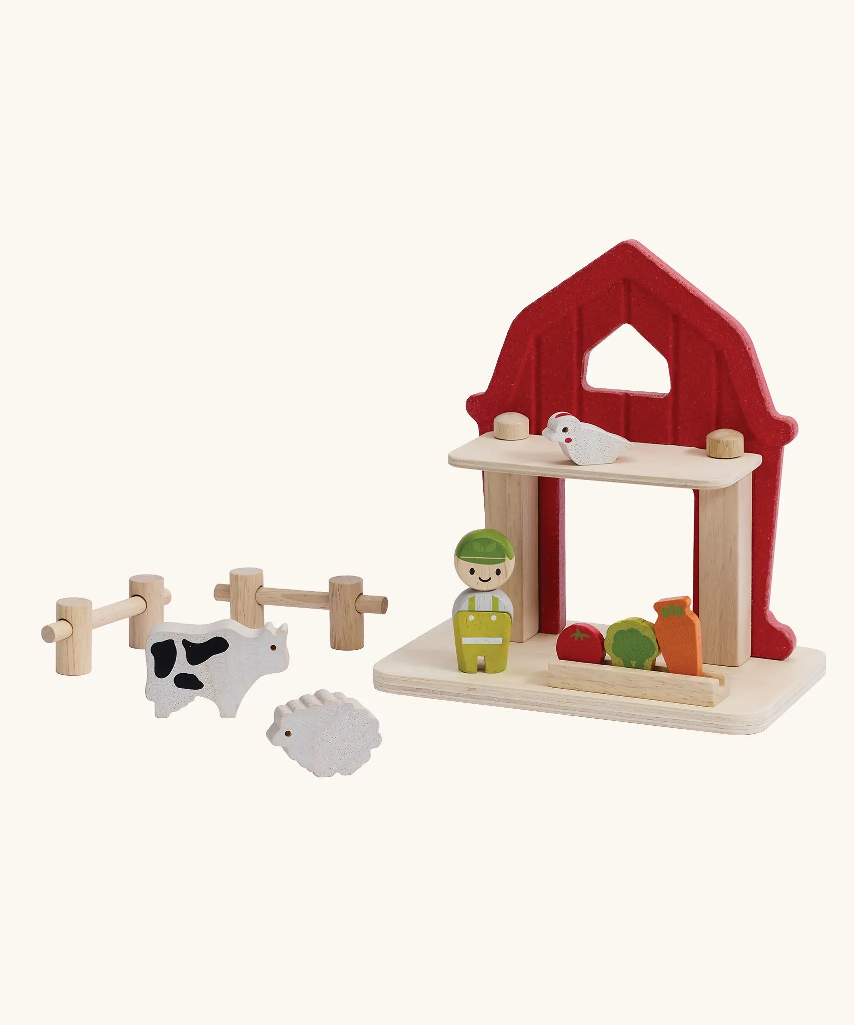 PlanToys barn house small world play set. Red wooden barn, mini veg patch, fences, cow, sheep, hen and farmer figure. 