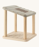 PlanToys wooden toy bathroom space, an open dollhouse shown without the pieces.