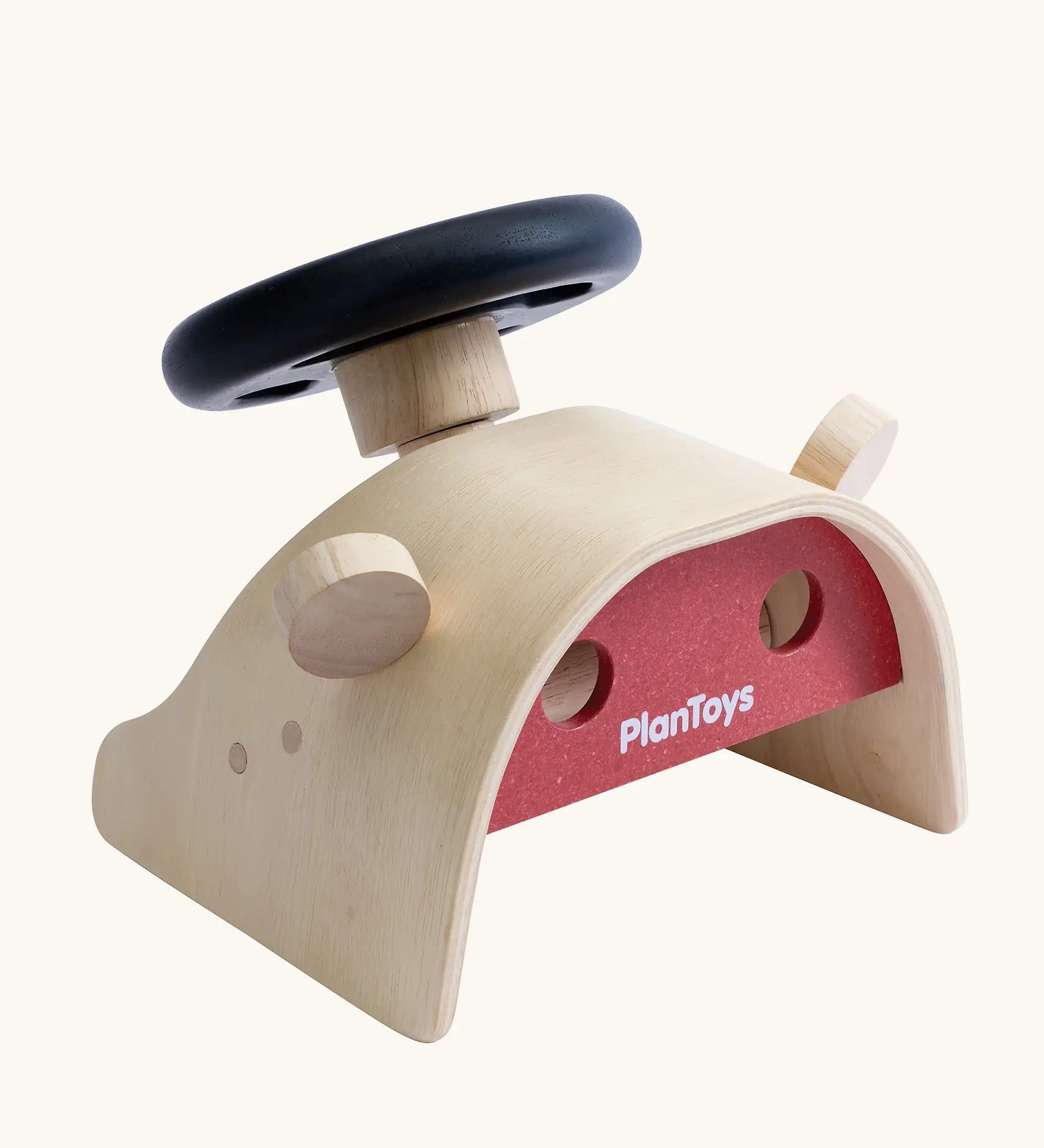 PlanToys Driving Console wooden toy. Black toy steering wheel on a wooden dashboard with wing mirrors.