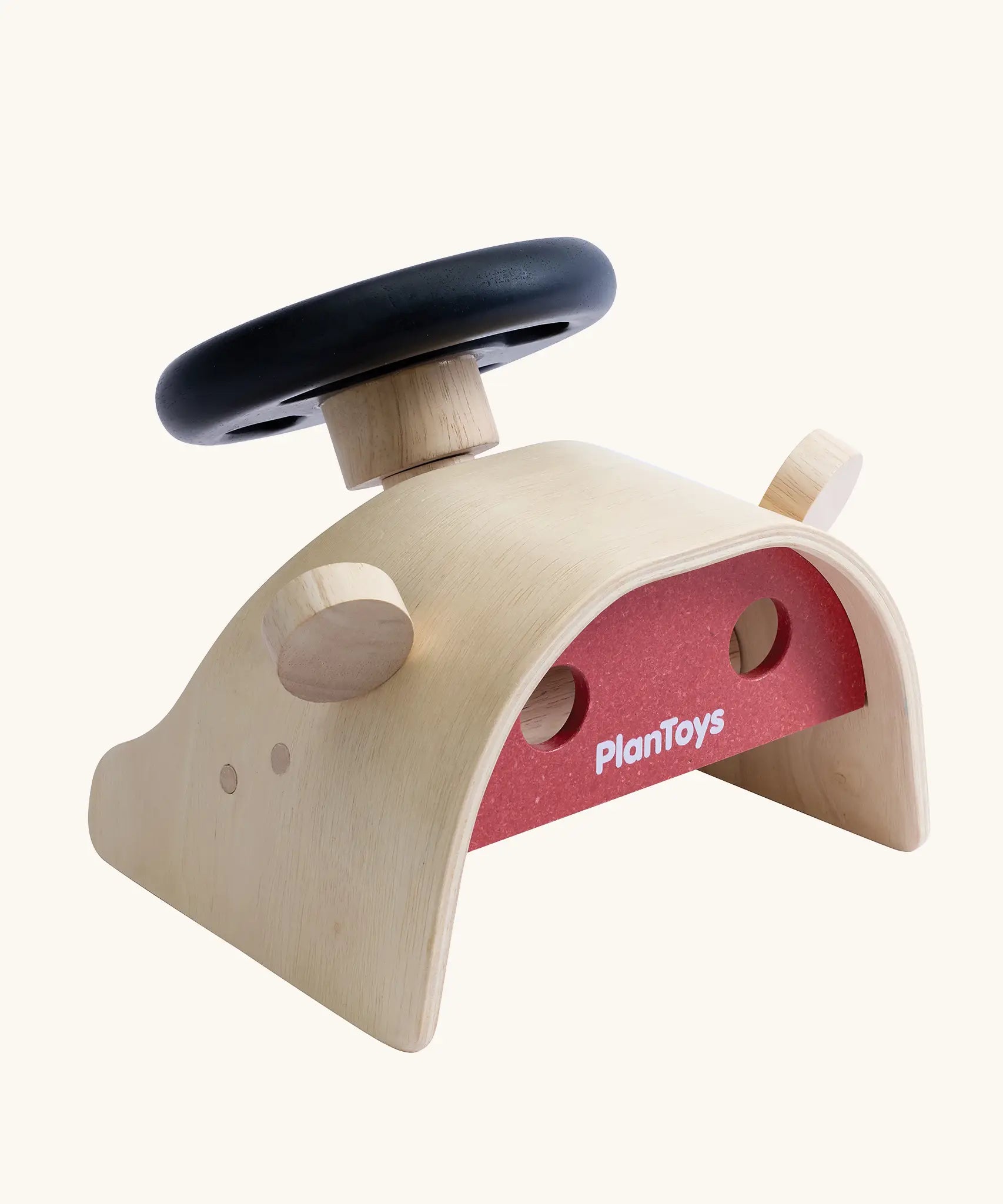 PlanToys Driving Console wooden toy. Black toy steering wheel on a wooden dashboard with wing mirrors.