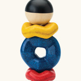 Baby crawling across a rug towards the wave stacking toy