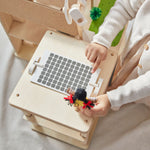 An overhead shot of teh solar panel that is on the roof of the PlanToys Green Dolls' House. 