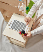 An overhead shot of teh solar panel that is on the roof of the PlanToys Green Dolls' House. 