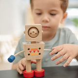 A child playing with the PlanToys Mood Bot Emotions Wooden Toy Robot. PlanToys range of toys are made from sustainably sourced rubberwood, we're proud stockists of PlanToys here at Babipur.  