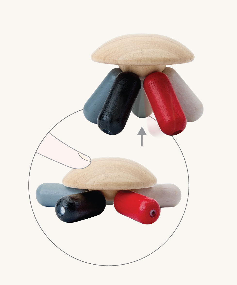 PlanToys Flexi Jellyfish wooden high contrast baby toy. A wooden top with high contrast, white, greys, black and red flexible wooden pieces for the jellyfish legs. PlanToys range of toys are made from sustainably sourced rubberwood, we're proud stockists of PlanToys here at Babipur. 