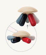 PlanToys Flexi Jellyfish wooden high contrast baby toy. A wooden top with high contrast, white, greys, black and red flexible wooden pieces for the jellyfish legs. PlanToys range of toys are made from sustainably sourced rubberwood, we're proud stockists of PlanToys here at Babipur. 