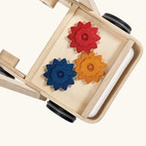 Overhead view of the PlanToys gear & go push along wooden baby walker.  The Base has three wooden gear cogs that turn.