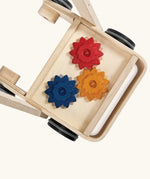 Overhead view of the PlanToys gear & go push along wooden baby walker.  The Base has three wooden gear cogs that turn.