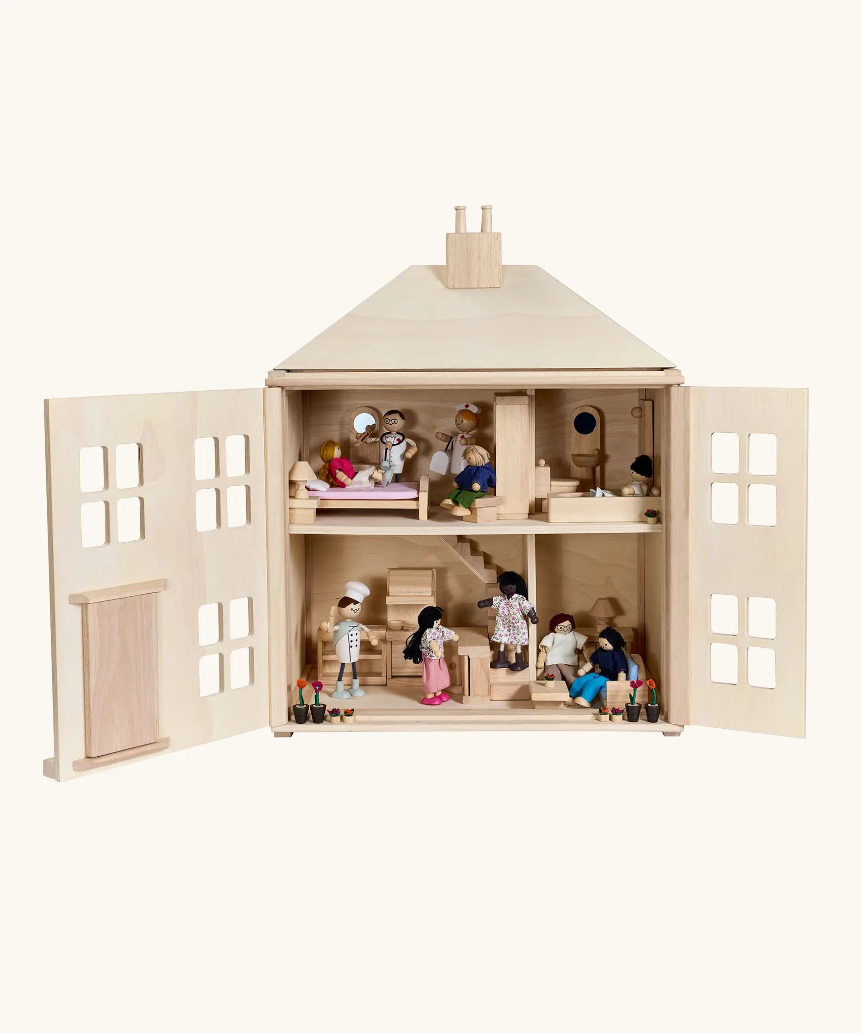 PlanToys wooden Georgian dollhouse children's toy. Front door are open and the rooms inside have been filled with wooden dolls house furniture and wooden dolls. 