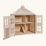 PlanToys wooden Georgian dollhouse children's toy shown with the front walls opened. 
