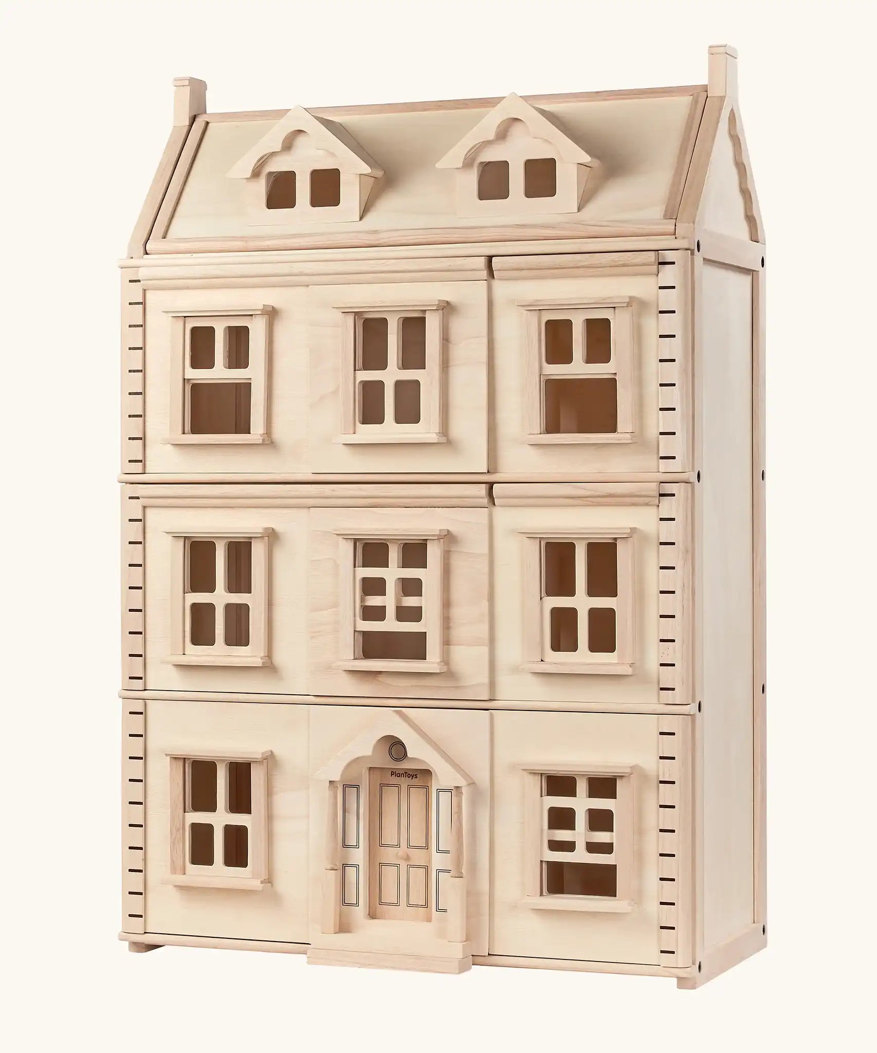 PlanToys Grand Victorian Dollhouse with thee floors and an attic level.