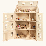 PlanToys Grand Victorian Dollhouse shown with front and roof open. All floors and attic room has PlanToys dolls house furniture inside.
