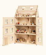 PlanToys Grand Victorian Dollhouse shown with front and roof open. All floors and attic room has PlanToys dolls house furniture inside.