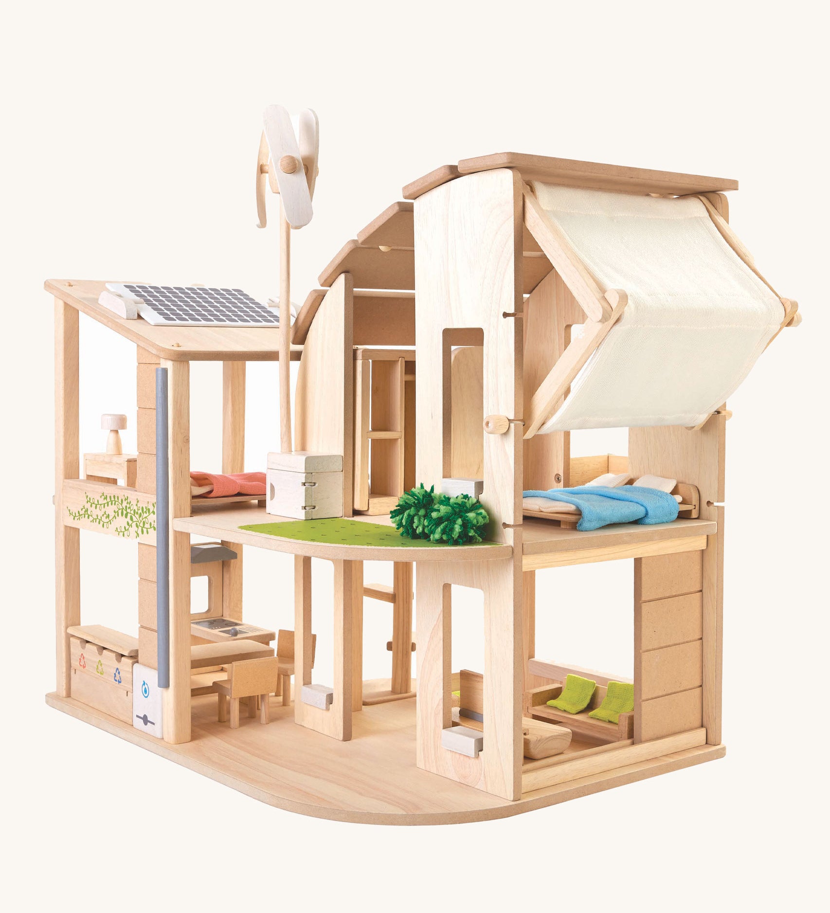 The Plan Toys Green Dolls' House and Furniture set on a plain background. 