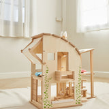 The PlanToys Green Dolls' House and Furniture Set placed on a white rug in the middle of a room.