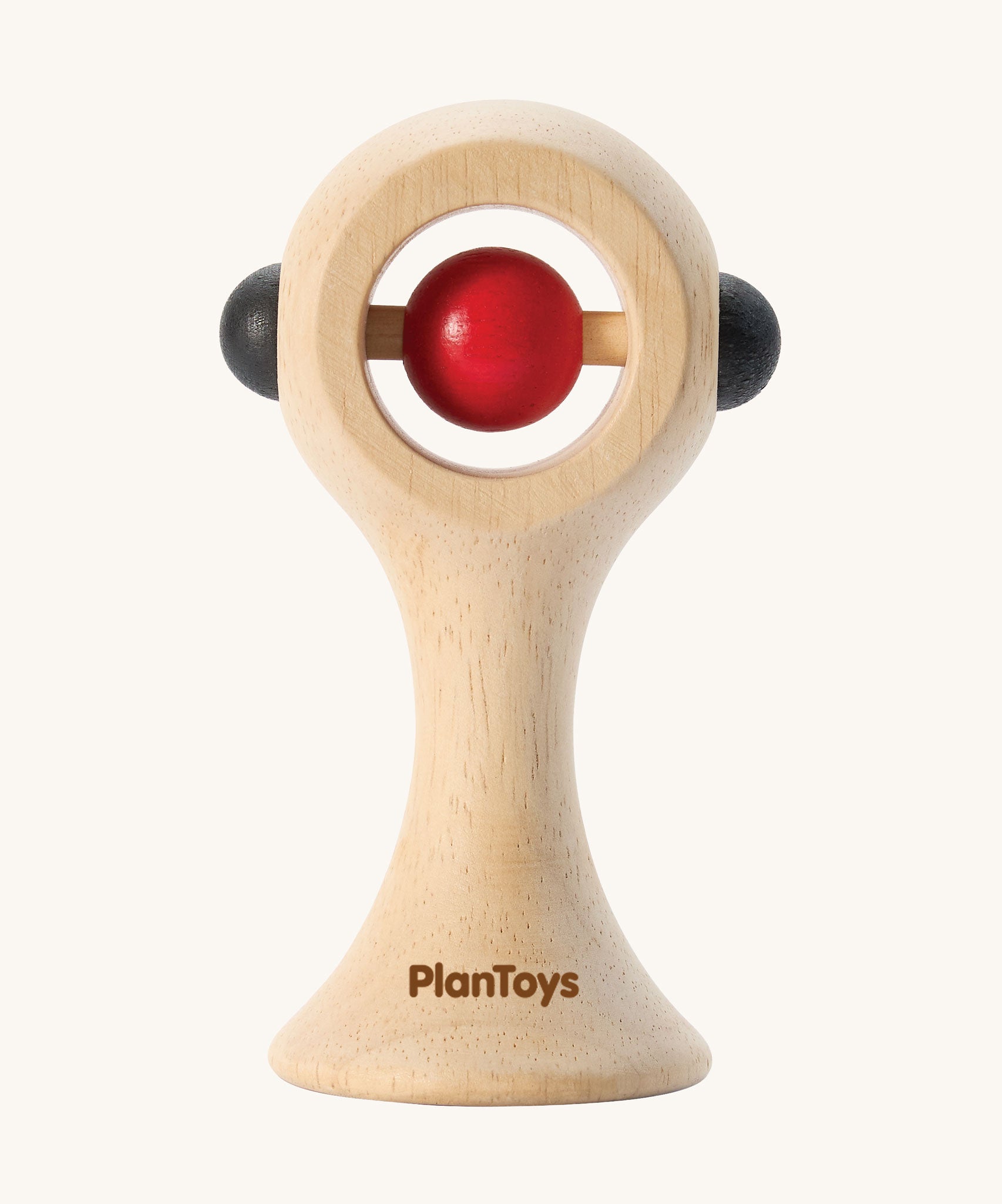 PlanToys Shaking Rattle in a High Contrast colourway. The red and black coloured details stand out against the natural rubberwood body. PlanToys range of toys are made from sustainably sourced rubberwood, we're proud stockists of PlanToys here at Babipur. 