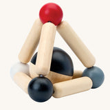 PlanToys high contrast Triangle baby Clutching Toy. A black and natural wood wooden ball in a stretchy triangle clutching toy. PlanToys range of toys are made from sustainably sourced rubberwood, we're proud stockists of PlanToys here at Babipur. 