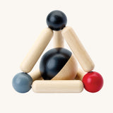 PlanToys high contrast Triangle baby Clutching Toy. A black and natural wood wooden ball in a stretchy triangle clutching toy. PlanToys range of toys are made from sustainably sourced rubberwood, we're proud stockists of PlanToys here at Babipur. 