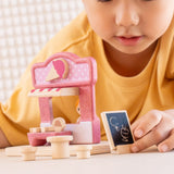 Child playing with the PlanToys ice cream shop wooden toy playset.