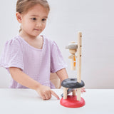 A child playing with the PlanToys Natural Rubberwood Jumping Acrobat Toy. PlanToys have a vast range of sustainable wooden toys are available at Babipur.