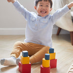 Young child sat on the floor cheering