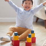 Young child sat on the floor cheering