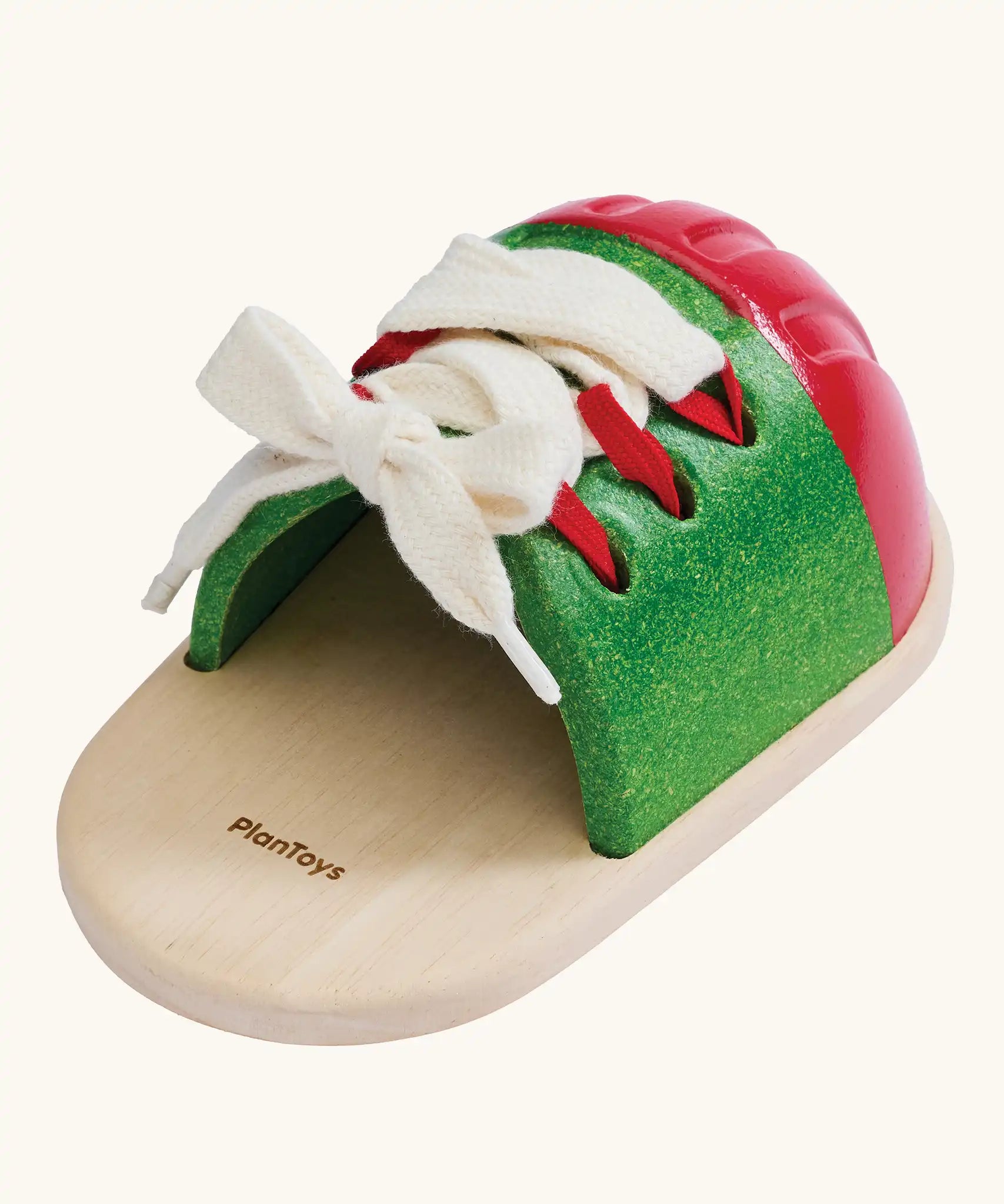 Back of the PlanToys life size tie-up laces wooden shoe children's toy. 