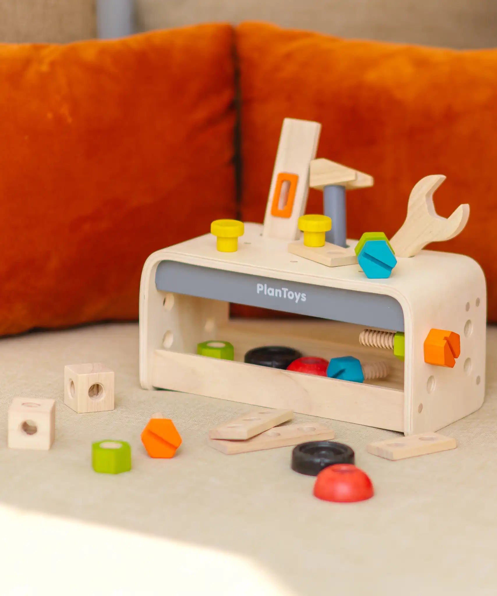 PlanToys little tool bench set shown in a home setting.
