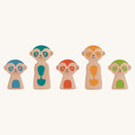 The meerkat figures from the PlanToys Meerkat Bowling Set lined up on a plain background. 