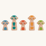 The meerkat figures from the PlanToys Meerkat Bowling Set lined up on a plain background. 