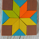 A star in a square shape created using pieces from the PlanToys Mini Mosaic Blocks
