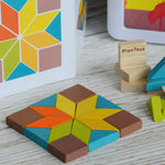 A shape created using pieces from the PlanToys mini mosaic set, the ideas leaflet can be seen in the background. 
