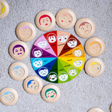 The PlanToys My Mood Memo placed on a light grey coloured carpet. 
