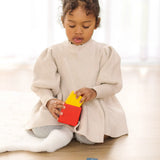 Child playing with the PlanToys nesting boxes.