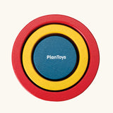 PlanToys Nesting Cylinders 3 piece wooden toy. Red, yellow and blue coloured wooden cylinder shaped wooden pieces that nest inside each other. 