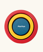 PlanToys Nesting Cylinders 3 piece wooden toy. Red, yellow and blue coloured wooden cylinder shaped wooden pieces that nest inside each other. 