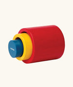 PlanToys Nesting Cylinders 3 piece wooden toy. Red, yellow and blue coloured wooden cylinder shaped wooden pieces that nest inside each other. 