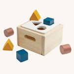 PlanToys Shape & Sort It Out in the Orchard colour way on a plain background. 