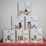 Six boxes of PlanToys wooden dollhouse furniture, stacked in a large discounted bundle at Babipur. 