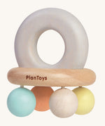 The PlanToys Pastel Bell Rattle on a plain background. 