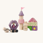 Pieces from the PlanToys Fairytale Castle Blocks on a plain background. 