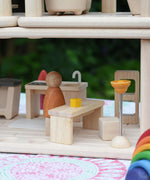 A close up of the dining set included with the PlanToys PlanSpace kitchen and dining room set. This set is part of a modular dolls house system available at Babipur. 