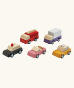 PlanToys PlanWorld vehicle wooden toy vehicles set. Red fire engine, purple truck, yellow taxi, pink convertible and black police car.