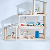 A full setup including all PlanToys wooden planspace sets stacked on top of eachother creating a space dolls house setup. 