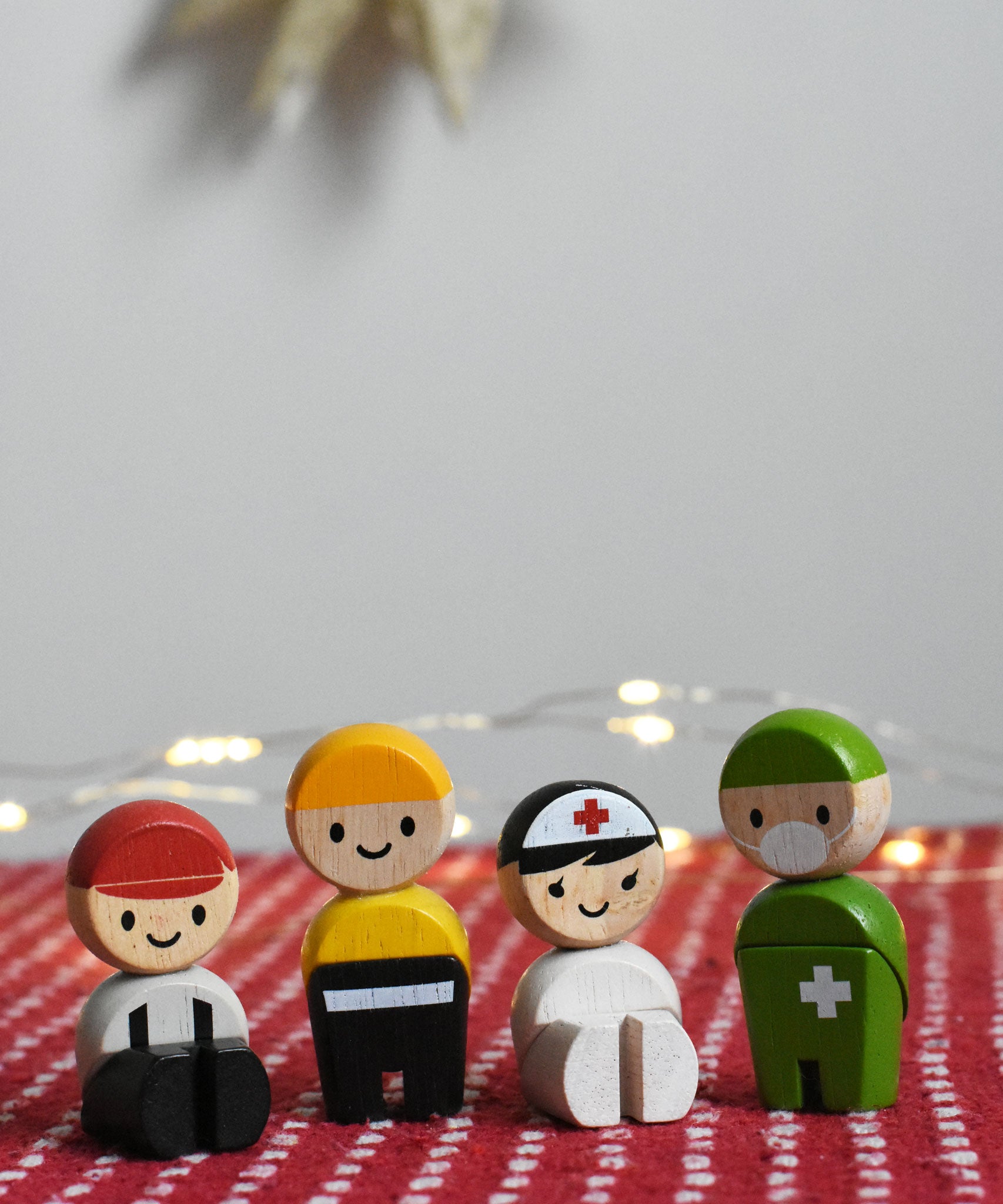 PlanToys Rescue Crew PlanWorld. Two of the wooden dolls are seated and two standing. 