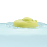 Close up of a PlanToys plastic-free natural rubber submarine toy floating in some water