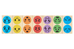 Pieces of the PlanToys mood dominos game in a line on a white background
